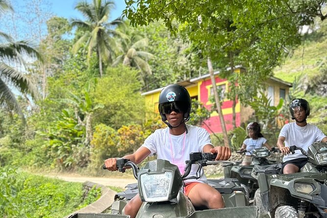 ATV, Horseback Riding and Bluehole Adventure Tour - ATV riding on hills and dirt roads