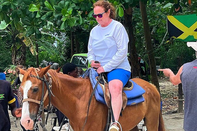Blue Hole, River Tubing, and Horse Ride with Swim Ocho Rios - Bamboo rafting offers a slower view of Jamaica