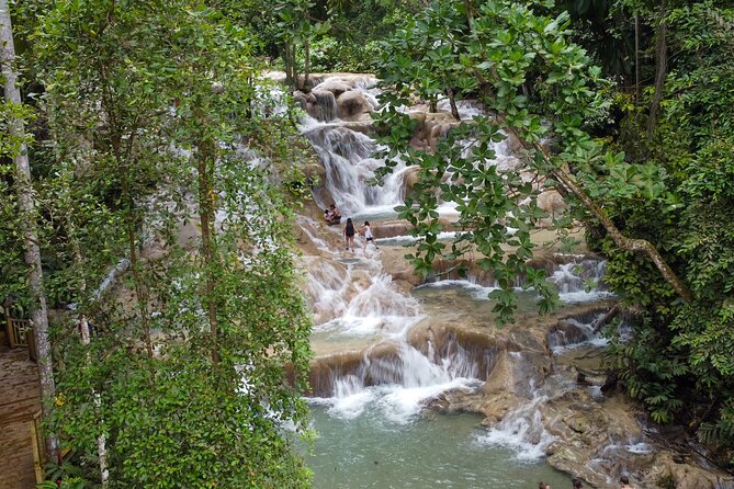 Dunns River Falls, Rafting, Zipline & Horseback from Montego Bay - The White River bamboo raft comes with an important warning