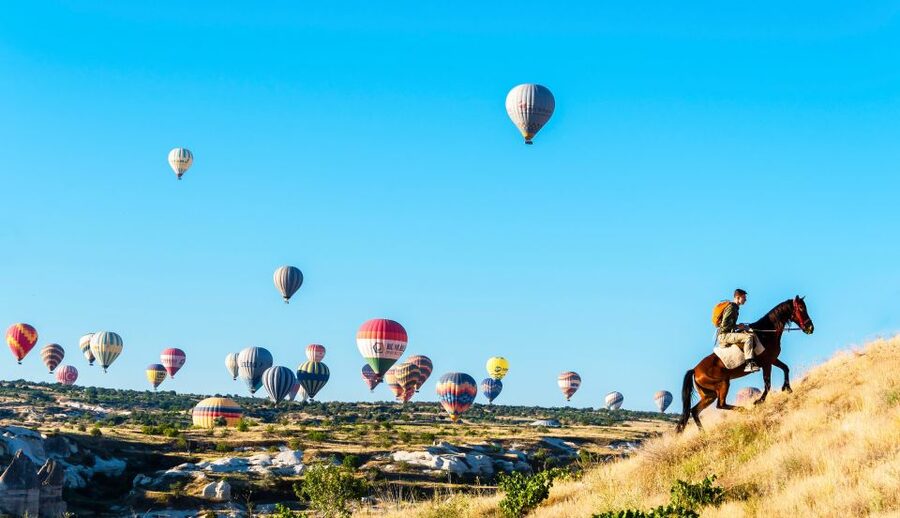 Goreme: Sunrise Horse Riding Excursion - The small mountain viewpoint and balloon photographs