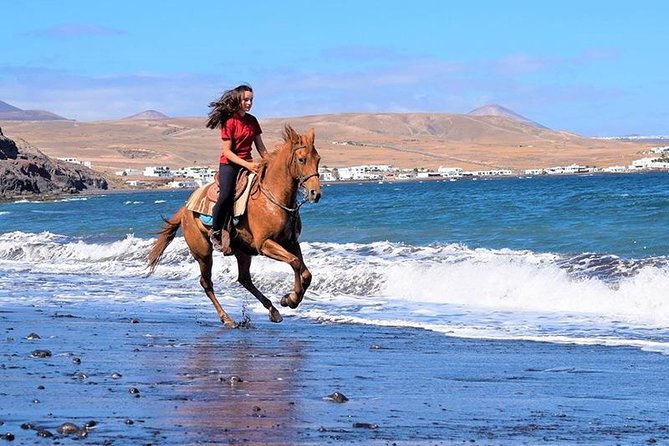 Horseback Riding in the sunset of Famara Beach, Lanzarote, Spain - The sunset factor and weather risk