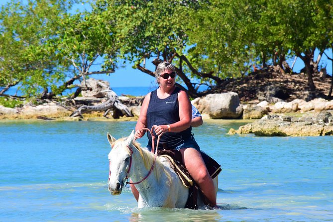 Negril 45-minute Guided Horseback Ride and Swim - Entering the Caribbean Sea on horseback