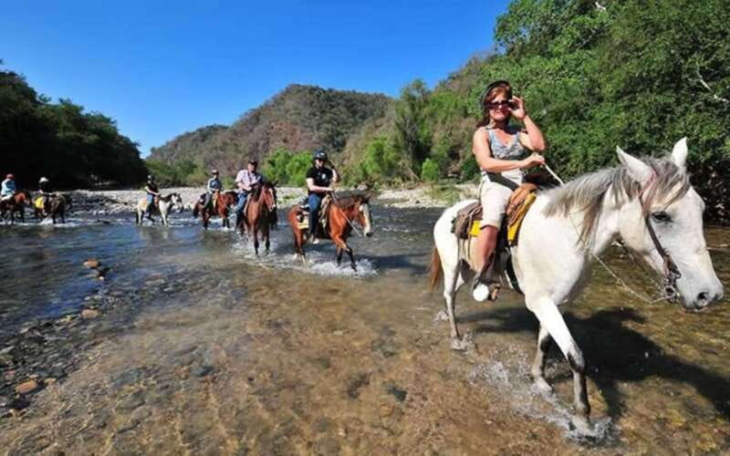Puerto Escondido: Sunset Horse Back Riding Tour - Two hours on horseback through jungle and farmland