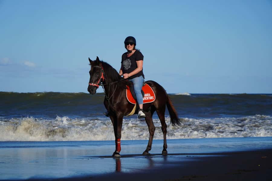 Sanur: Horse Riding at the Bali Beach 30 minute ride - Riding from the stable toward the black sand