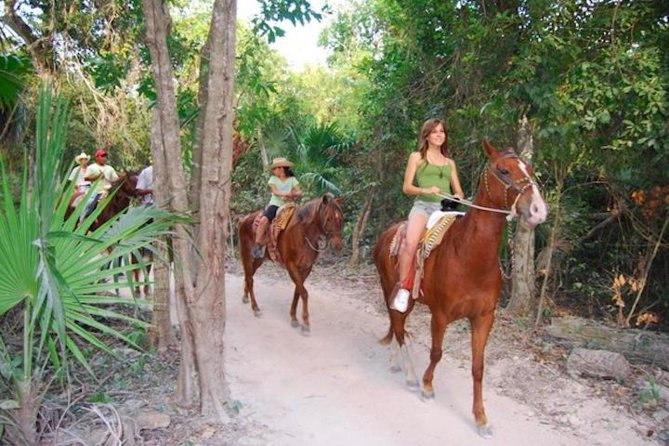 Ziplining and Horseback Riding Experience from Cancun and Playa del Carmen - Getting airborne on the zipline course